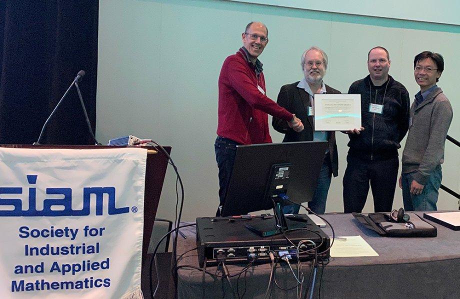 Robert van de Geijn, Lee Killough, and Tze Meng Low accepting the award at PP20 in Seattle, Washington