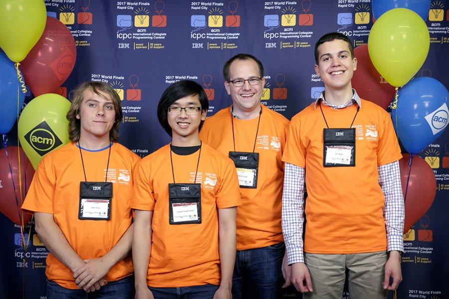 UT Competitive Programming team: Brian Richer, Supawit Chockchowwat, faculty coach Etienne Vouga, and Alex Meed.