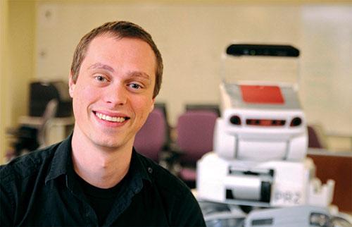 Assistant Professor Scott Niekum with a robot in the PeARL Lab at UT Computer Science