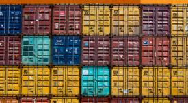Stacks of shipping containers side-by-side in various colors.