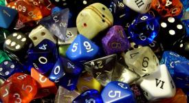 Pile of different colored and shaped dice.