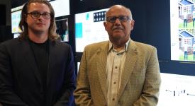 Computer scientists Ryan Farell and Chandrajit Bajaj will test a novel reinforcement learning approach. Computer scientists Ryan Farell and Chandrajit Bajaj standing side-by-side in front of the visualization wall in the POB Vis Lab.