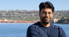 Shravan Narayan standing in front of beach.