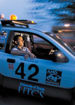 Dr. Peter Stone takes a ride in Marvin, an autonomous vehicle, while it drives him down the street.