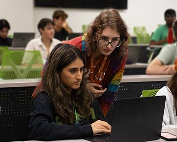 student working in computer science lab learning coding for robotics