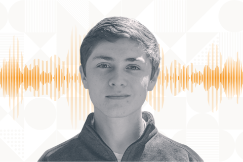 Turing student Alan Baade pictured in gray and white against geometic print on white background and orange soundwaves running behind Alan's head.