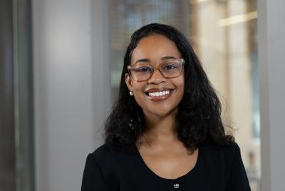 Kimberly Cano wearing a black top, with a blurred background