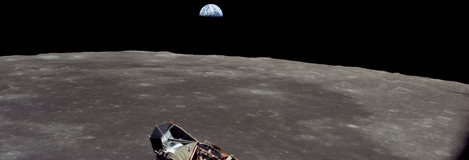 view of Earth and the moon from the Apollo 11 mission.  Also shown is 
the lunar module as it rises to meet the spacecraft.
