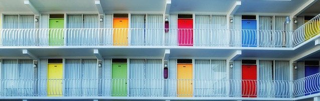 two floors of colorful motel room doors