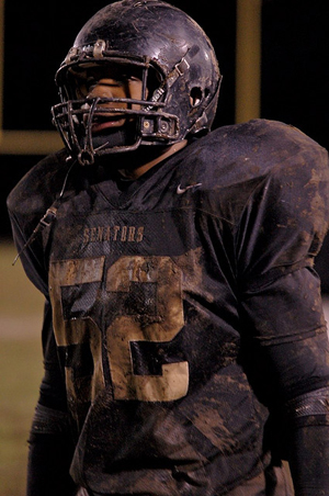 Muddy football player